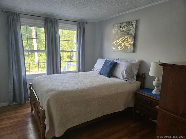 60 Spring Glen Rd, East Lyme, CT 06357 - bedroom featuring dark wood-type flooring, a textured ceiling, and ornamental molding