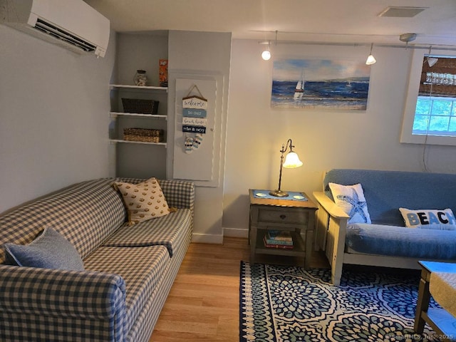 60 Spring Glen Rd, East Lyme, CT 06357 - living room with a wall mounted AC and wood finished floors