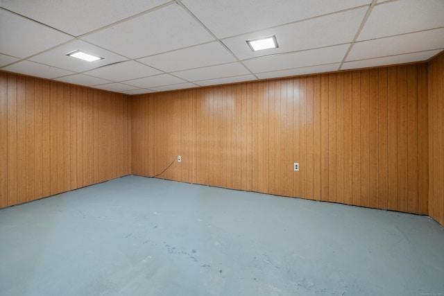 45 Summit Rd, Prospect, CT 06712 - spare room featuring concrete floors, a paneled ceiling, and wood walls