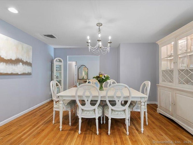 964 Red Fox Rd, Orange, CT 06477 - dining area featuring a chandelier and light wood-type flooring