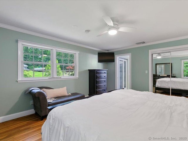 964 Red Fox Rd, Orange, CT 06477 - bedroom with wood finished floors, crown molding, a closet, and a ceiling fan
