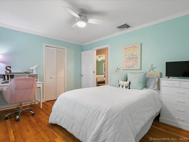 964 Red Fox Rd, Orange, CT 06477 - bedroom with a closet, ornamental molding, wood finished floors, and ceiling fan