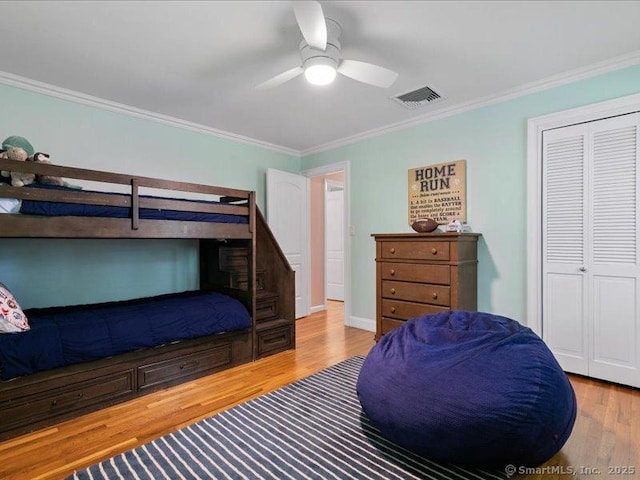 964 Red Fox Rd, Orange, CT 06477 - bedroom featuring crown molding, wood finished floors, a closet, and ceiling fan