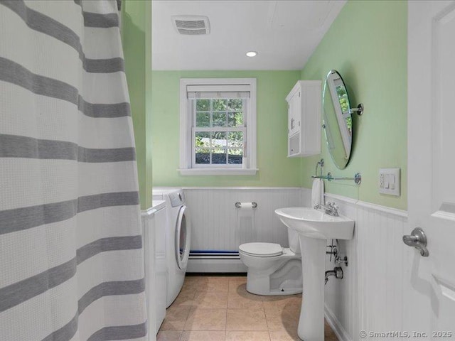 964 Red Fox Rd, Orange, CT 06477 - full bath featuring independent washer and dryer, wainscoting, a baseboard heating unit, tile patterned flooring, and a shower with curtain