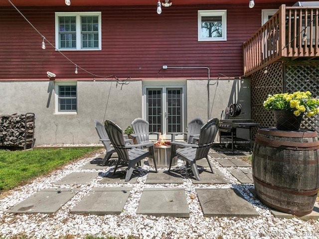 964 Red Fox Rd, Orange, CT 06477 - view of patio featuring a fire pit, french doors, and area for grilling