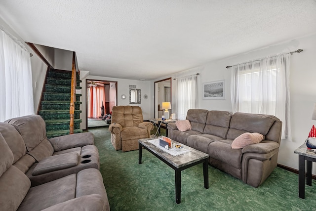 141 Peach Orchard Rd, Waterbury, CT 06706 - living room featuring carpet, a textured ceiling, and stairway