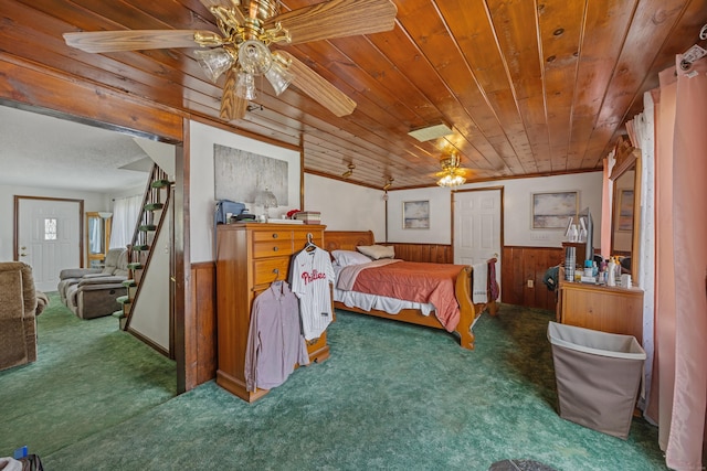 141 Peach Orchard Rd, Waterbury, CT 06706 - bedroom with carpet flooring, wooden ceiling, a wainscoted wall, wooden walls, and ceiling fan