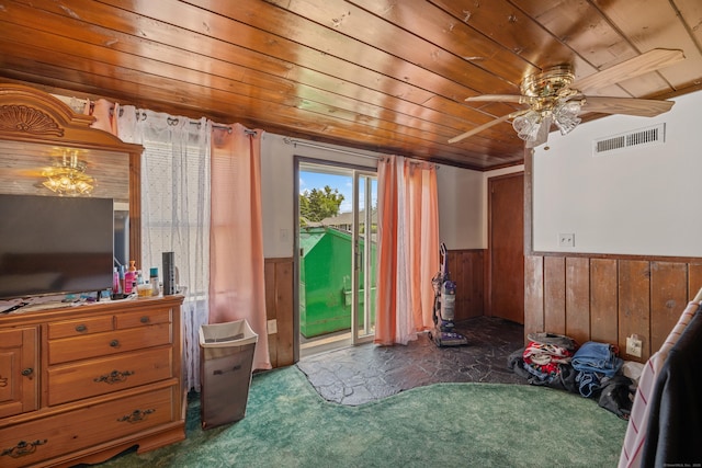 141 Peach Orchard Rd, Waterbury, CT 06706 - bedroom featuring wooden ceiling, a wainscoted wall, carpet, access to exterior, and wood walls