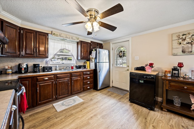 141 Peach Orchard Rd, Waterbury, CT 06706 - kitchen with appliances with stainless steel finishes, healthy amount of natural light, light countertops, light wood-type flooring, and crown molding