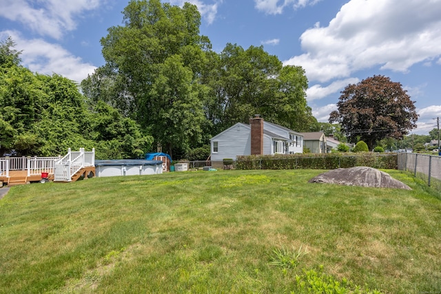 141 Peach Orchard Rd, Waterbury, CT 06706 - fenced backyard featuring a deck and a covered pool