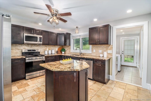 857 Marion Rd, Cheshire, CT 06410 - kitchen featuring stainless steel appliances, dark brown cabinetry, decorative backsplash, ceiling fan, and recessed lighting