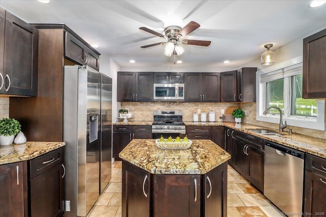 857 Marion Rd, Cheshire, CT 06410 - kitchen with stainless steel appliances, tasteful backsplash, a ceiling fan, light stone counters, and recessed lighting