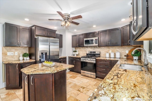 857 Marion Rd, Cheshire, CT 06410 - kitchen with stainless steel appliances, ceiling fan, recessed lighting, tasteful backsplash, and dark brown cabinets