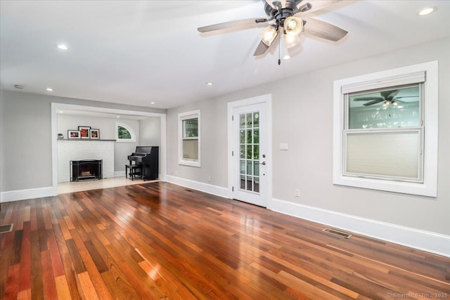 857 Marion Rd, Cheshire, CT 06410 - unfurnished living room with wood-type flooring, recessed lighting, a ceiling fan, and a fireplace