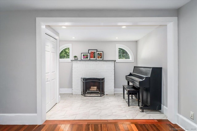 857 Marion Rd, Cheshire, CT 06410 - living area with marble finish floors, a fireplace, and recessed lighting