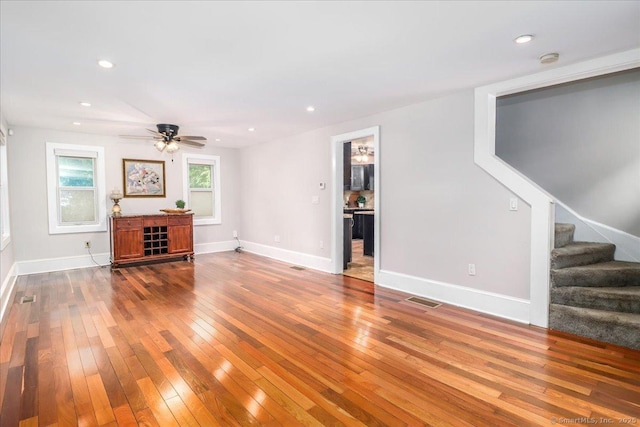 857 Marion Rd, Cheshire, CT 06410 - unfurnished living room with hardwood / wood-style floors, stairs, a ceiling fan, and recessed lighting
