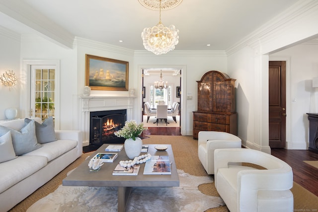 31 Contentment Island Rd, Darien, CT 06820 - living area with a chandelier, wood finished floors, crown molding, a warm lit fireplace, and recessed lighting