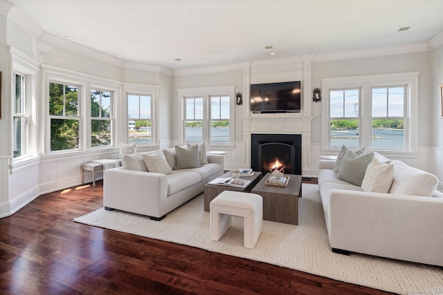 31 Contentment Island Rd, Darien, CT 06820 - living area featuring wood finished floors, a fireplace, a wainscoted wall, ornamental molding, and a decorative wall