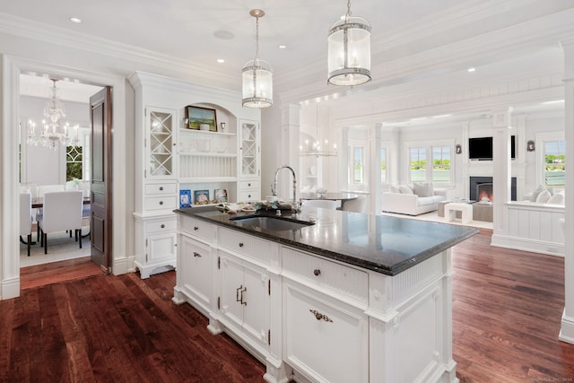 31 Contentment Island Rd, Darien, CT 06820 - kitchen featuring a chandelier, dark wood-style floors, white cabinetry, a kitchen island with sink, and crown molding