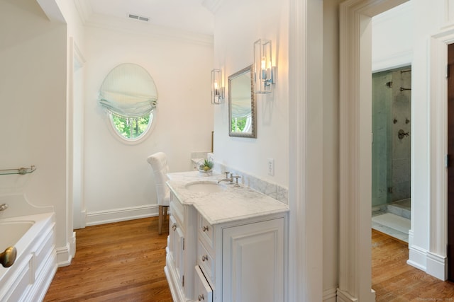 31 Contentment Island Rd, Darien, CT 06820 - bathroom with vanity, an enclosed shower, ornamental molding, a bath, and wood finished floors