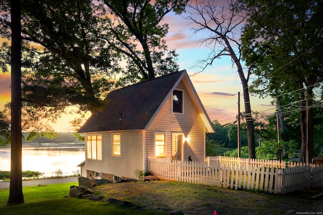 31 Contentment Island Rd, Darien, CT 06820 - view of front of property with a water view and a shingled roof