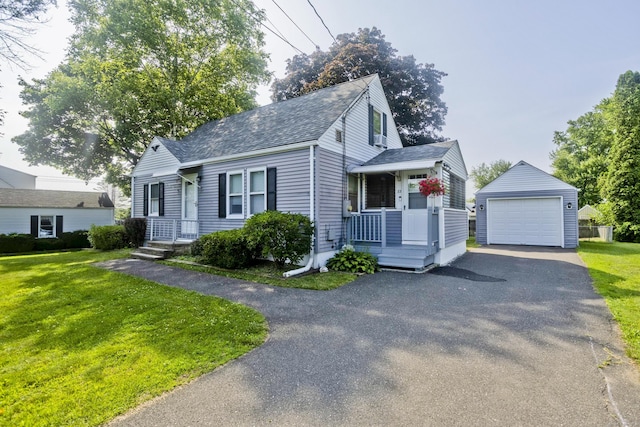 33 Old King St, Enfield, CT 06082 - view of front of home featuring roof with shingles, an outdoor structure, a garage, and a front yard