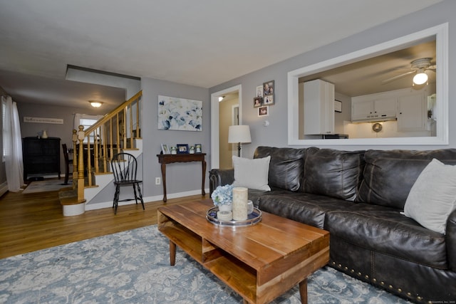 33 Old King St, Enfield, CT 06082 - living area featuring wood finished floors, stairway, and a ceiling fan