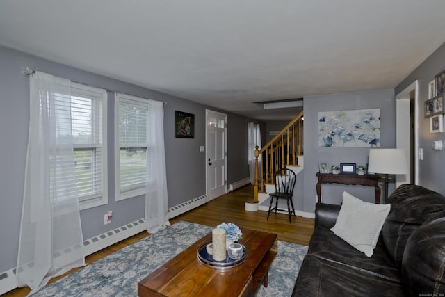 33 Old King St, Enfield, CT 06082 - living room with a baseboard heating unit, stairway, wood finished floors, and a baseboard radiator