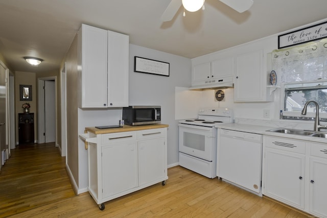 33 Old King St, Enfield, CT 06082 - kitchen featuring white appliances, under cabinet range hood, light wood-style flooring, and white cabinets