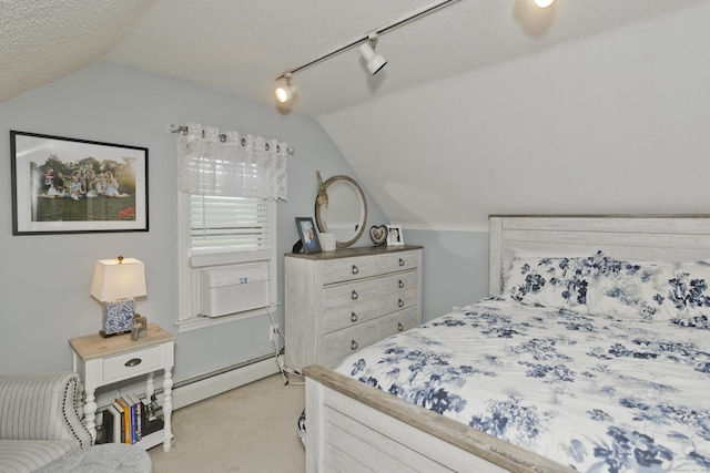 33 Old King St, Enfield, CT 06082 - bedroom with lofted ceiling, light colored carpet, cooling unit, and a baseboard heating unit