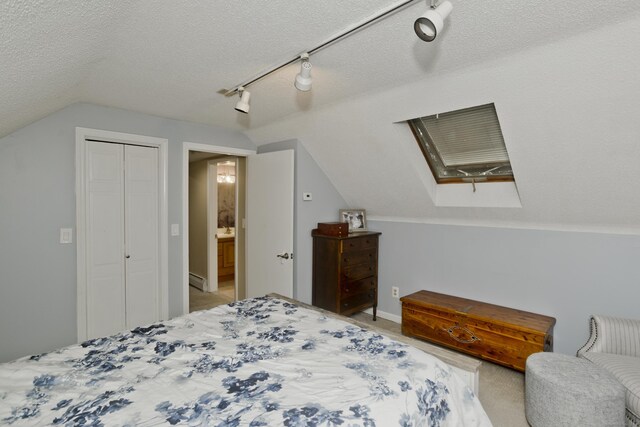 33 Old King St, Enfield, CT 06082 - bedroom with vaulted ceiling, rail lighting, a closet, carpet, and a textured ceiling