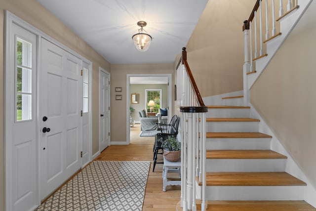 2 Applewood Cmn, East Lyme, CT 06333 - foyer featuring plenty of natural light, wood finished floors, and stairway