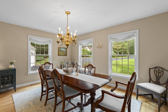 2 Applewood Cmn, East Lyme, CT 06333 - dining space with a chandelier and light wood-type flooring