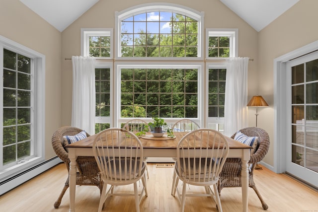 2 Applewood Cmn, East Lyme, CT 06333 - dining area featuring a baseboard radiator, plenty of natural light, wood finished floors, and high vaulted ceiling