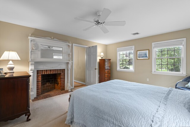 2 Applewood Cmn, East Lyme, CT 06333 - bedroom with a brick fireplace, carpet flooring, and a ceiling fan