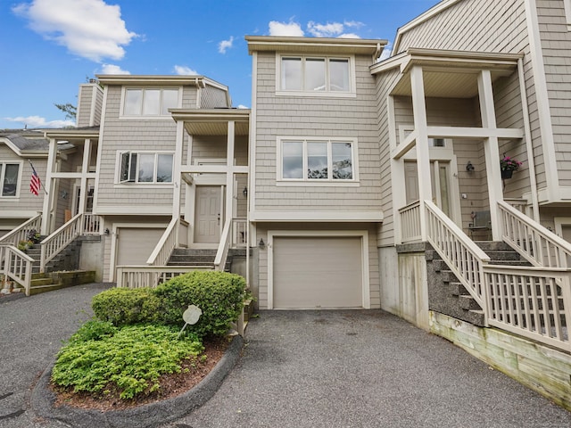 11 Boulevard Dr Unit 10-44, Danbury, CT 06810 - view of front of home featuring stairway, asphalt driveway, and a garage