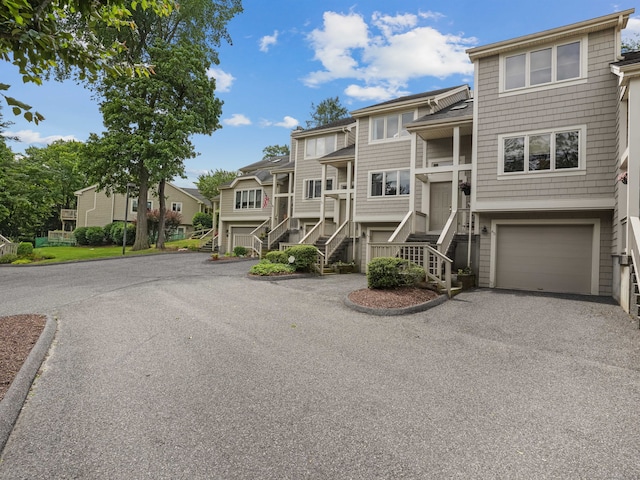 11 Boulevard Dr Unit 10-44, Danbury, CT 06810 - view of front of house featuring stairway, a residential view, an attached garage, and driveway