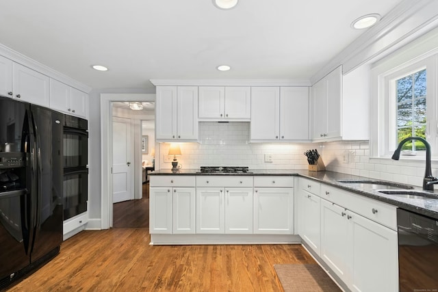 39 Campbell Rd, Fairfield, CT 06824 - kitchen featuring black appliances, backsplash, white cabinetry, light wood finished floors, and recessed lighting