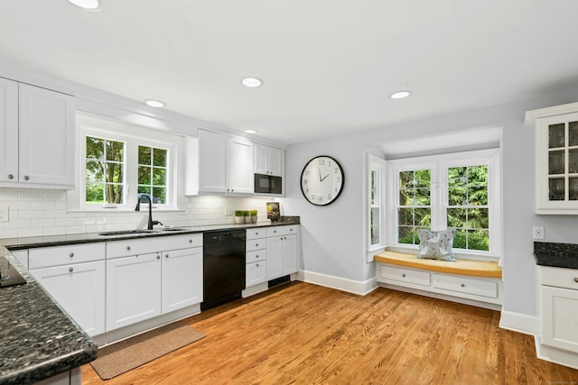 39 Campbell Rd, Fairfield, CT 06824 - kitchen with black appliances, decorative backsplash, white cabinetry, healthy amount of natural light, and recessed lighting