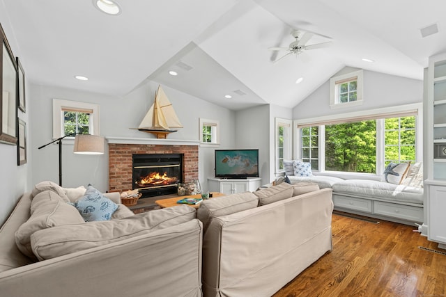 39 Campbell Rd, Fairfield, CT 06824 - living room with a ceiling fan, vaulted ceiling, wood finished floors, a brick fireplace, and recessed lighting