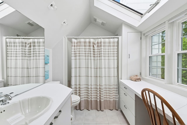39 Campbell Rd, Fairfield, CT 06824 - full bathroom featuring a skylight, lofted ceiling, vanity, tile patterned floors, and a shower with curtain