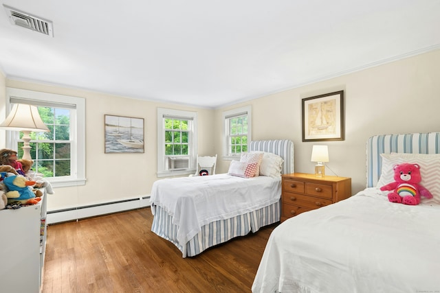 39 Campbell Rd, Fairfield, CT 06824 - bedroom with a baseboard radiator, wood finished floors, multiple windows, and ornamental molding