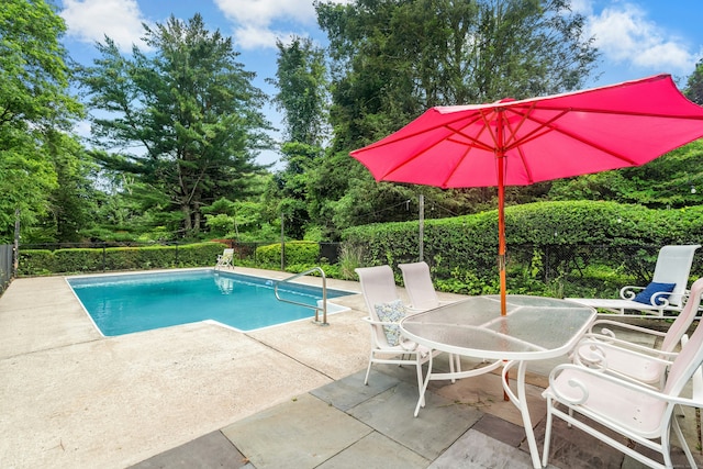 39 Campbell Rd, Fairfield, CT 06824 - view of swimming pool with a patio area, a fenced backyard, and view of wooded area
