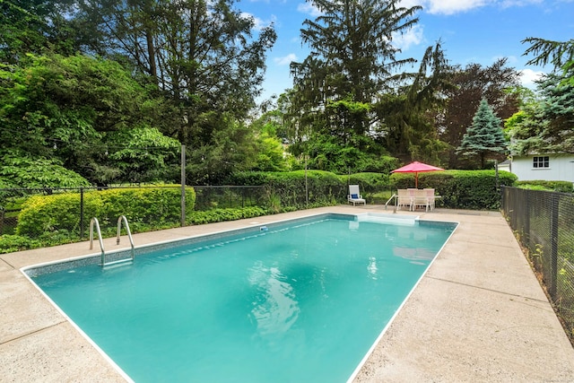 39 Campbell Rd, Fairfield, CT 06824 - view of pool featuring a patio area, view of scattered trees, and outdoor dining space