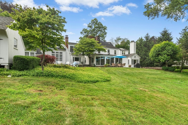 39 Campbell Rd, Fairfield, CT 06824 - view of grassy yard with a patio area