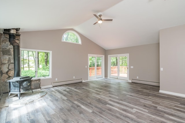 63 Rose Haven Rd, Somers, CT 06071 - unfurnished living room with a baseboard radiator, baseboard heating, a wood stove, a ceiling fan, and wood finished floors