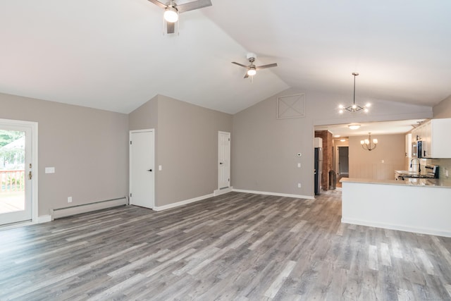 63 Rose Haven Rd, Somers, CT 06071 - unfurnished living room with baseboard heating, vaulted ceiling, a chandelier, light wood-style flooring, and a ceiling fan