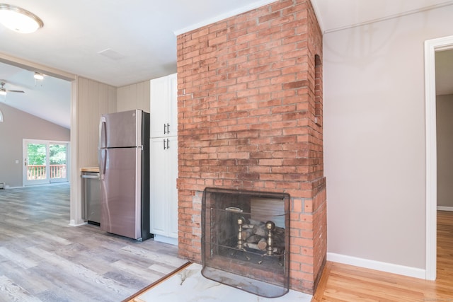 63 Rose Haven Rd, Somers, CT 06071 - unfurnished living room with light wood finished floors, lofted ceiling, a brick fireplace, and ceiling fan