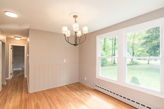63 Rose Haven Rd, Somers, CT 06071 - unfurnished room with baseboard heating, a chandelier, a wainscoted wall, and light wood finished floors