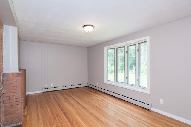 63 Rose Haven Rd, Somers, CT 06071 - spare room with baseboard heating, wood finished floors, and wood walls